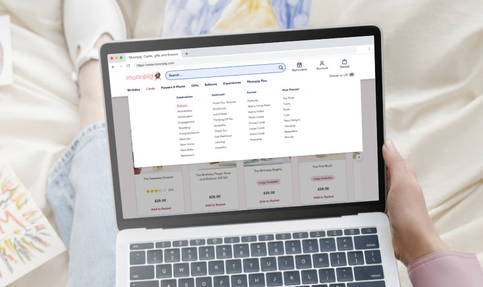 Person browsing moonpig website on laptop